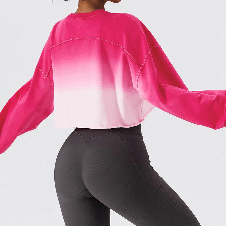 Stylish pink gradient long sleeve crop top for women, O-neck design, breathable cotton, perfect for active lifestyle, rear view.